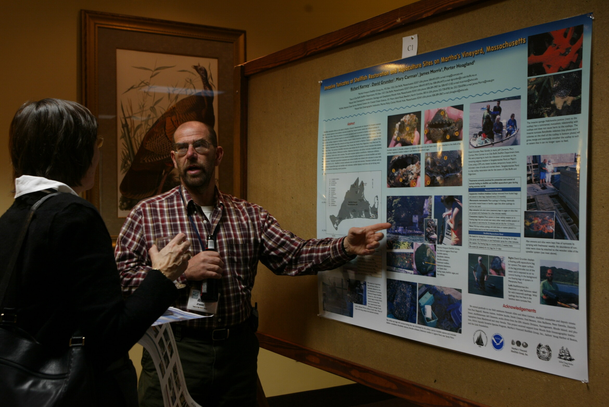 Delegates in conversation in front of research posters at a previous ICSR poster session